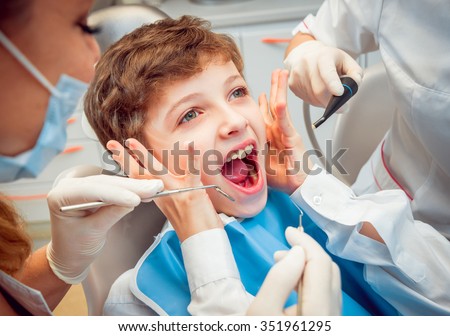 Crying and screaming little boy at the dentist