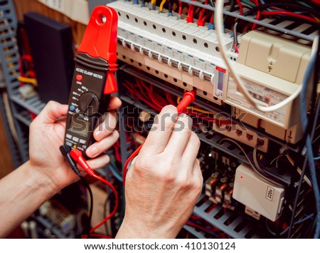 Electrical equipment. Tester in the hands.  Background and texture