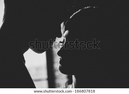 Silhouette. Falling in love. Romanticism. Kiss.