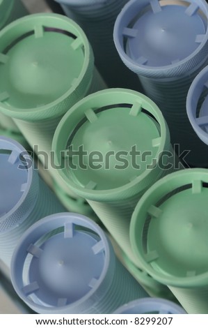 Close up of blue and green hot rollers