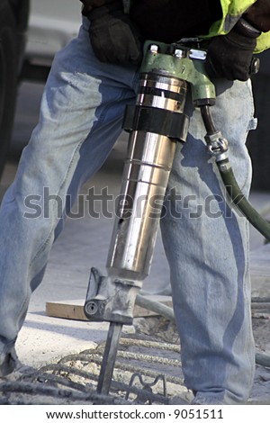 Man working a jack hammer
