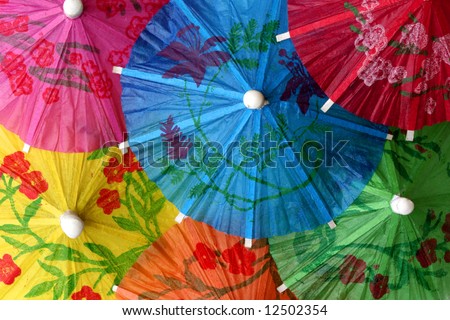 Close up of colorful cocktail umbrellas perfect for background