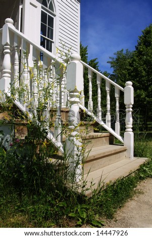 Weeds by wooden steps