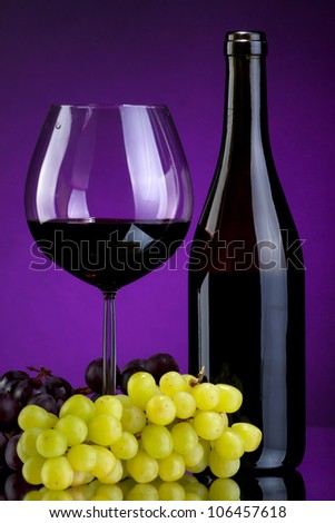 Still-life with bottle of wine, grapes and glass of red wine