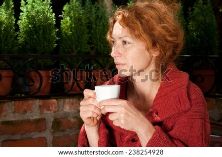 woman without makeup waking up with morning coffee