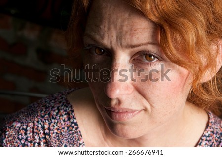 portrait of woman half face in the shadow