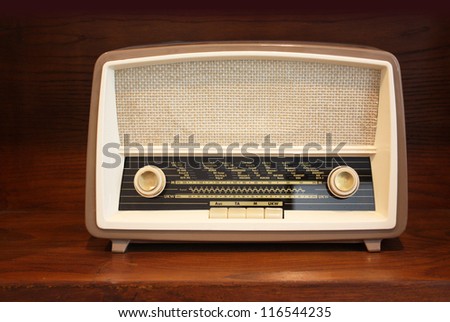 Old radio on wooden shelf