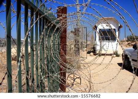 Barbed wire on a fence alongside a border in Israel