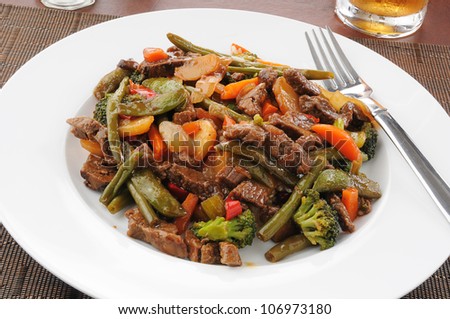 Beef stir fry with beans, broccoli, sugar snap or snow peas and carrots