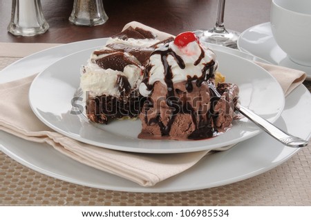 Chocolate cream pie with ice cream and chocolate syrup