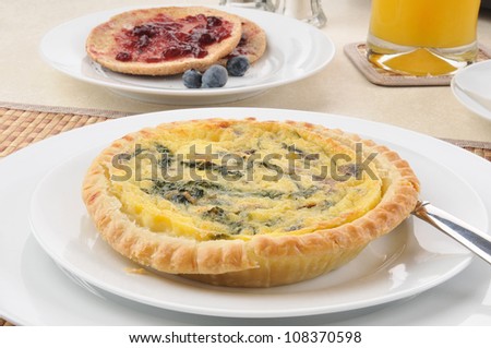 A close up of spinach quiche and toast