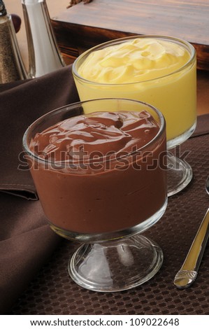 Dessert cups of chocolate and vanilla pudding