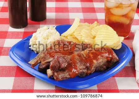 Barbecued pork ribs with sauce and cole slaw