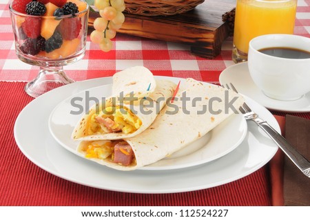 Breakfast burritos with fruit cocktail and coffee