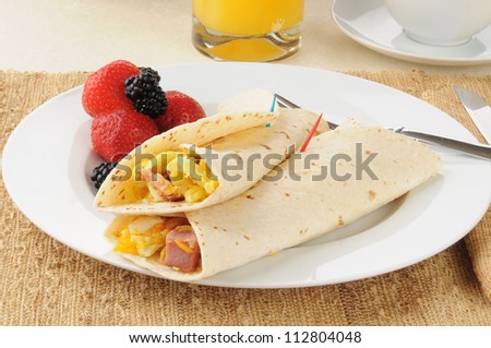 Breakfast burritos with strawberries and blackberries