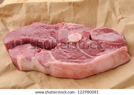 A lamb shoulder chop on butcher paper
