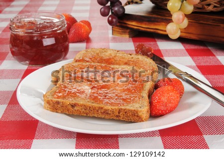Fresh strawberry jam on sprouted organic whole wheat toast