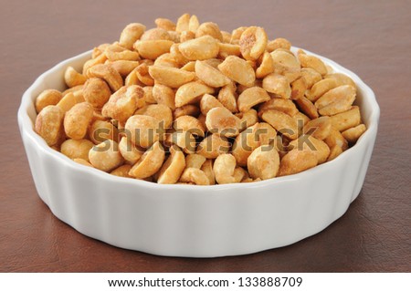 Closeup of a bowl of dry roasted peanuts