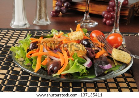 A garden salad with black and Greek olives