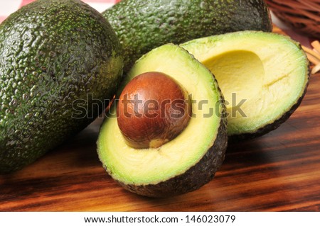 A sliced avocado on a cutting board