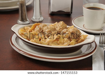 Swedish meatballs on pasta with sour cream sauce and coffee