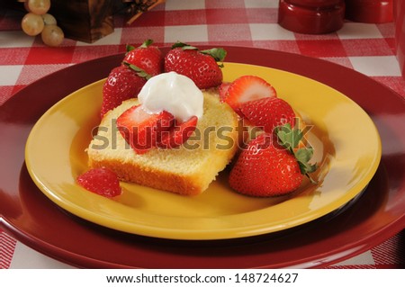 Close up of strawberry shortcake on colorful plates