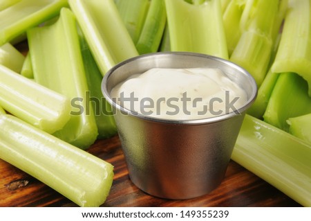 Fresh cut celery sticks and a dish of Ranch dressing dip