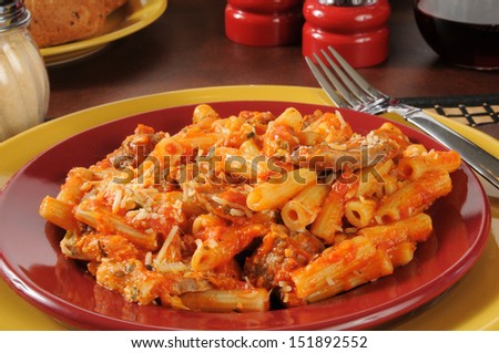 Closeup of rigatoni with Italian sausage, meatballs, mozzarella cheese and marinara sauce
