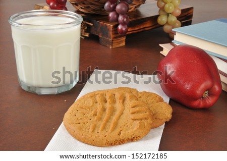 Cookies, milk and an apple as an after school snack