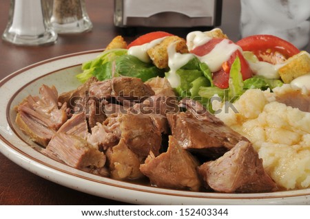 Succulent pork roast closeup, served in a country diner