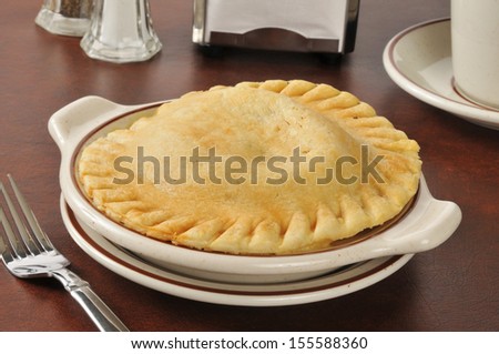 A fresh baked chicken pot pie served in a country diner