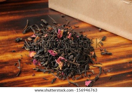 A brown back of rose infused whole leaf black tea