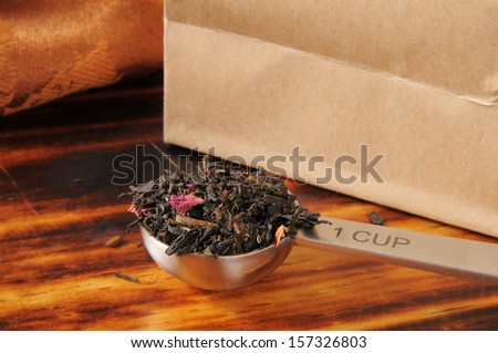 A measuring spoon of rose infused loose leaf black tea