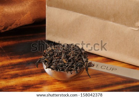 A measuring spoon of whole leaf black tea