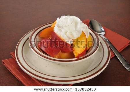 Fresh sliced peaches topped with whipped cream