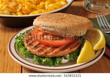 A grilled salmon burger with baked macaroni and cheese