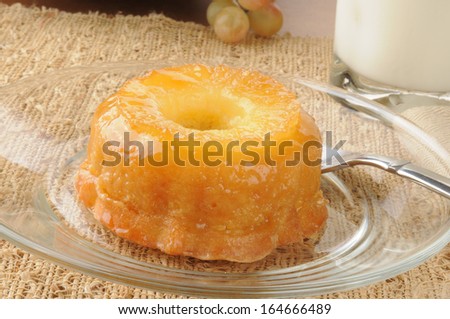 A mini pineapple upside down cake with milk