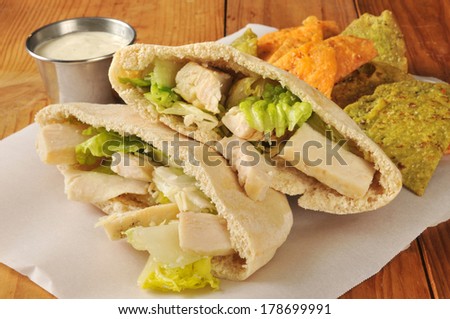 Chicken Caesar Salad in a Pita Pocket with Vegetable Tortilla Chips