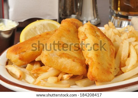 Closeup of beer battered fish sticks with french fries