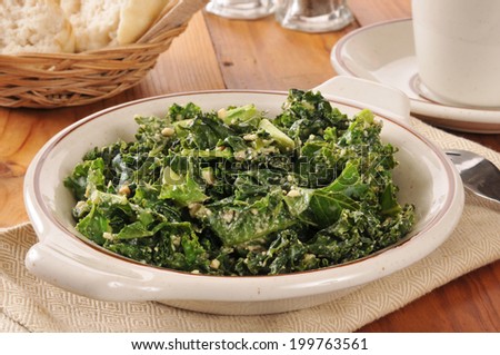 A kale salad with feta cheese and a Vinaigrette dressing