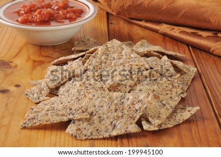 Healthy tortilla chips made from rice and beans with salsa