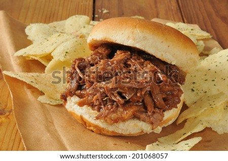 A barbecue beef sandwich with sour cream and chive potato chips