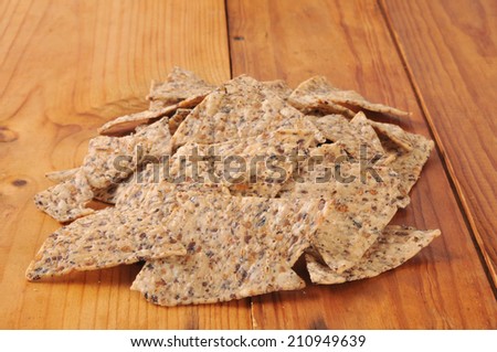 Rice and bean tortilla chips on a rustic wooden table