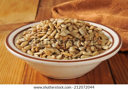 A bowl of roasted, hulled and salted sunflower seeds