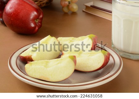 Sliced apples and milk as a healthy after school snack