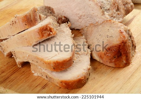 Sliced natural grain fed turkey on a cutting board
