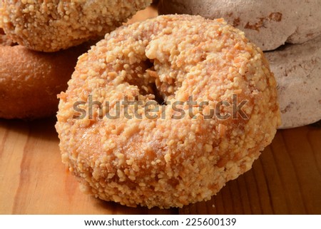 Assorted cake donuts on a rustic wooden counter