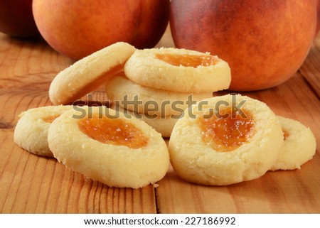 A stack of shortbread cookies filled with peach jam