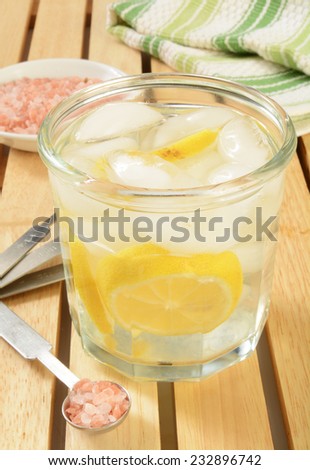 A glass of alkaline water made with Himalayan salt, lemons and purified water