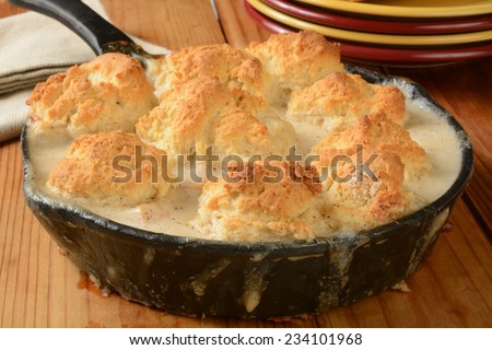 A home baked chicken pot pie or casserole in a cast iron skillet